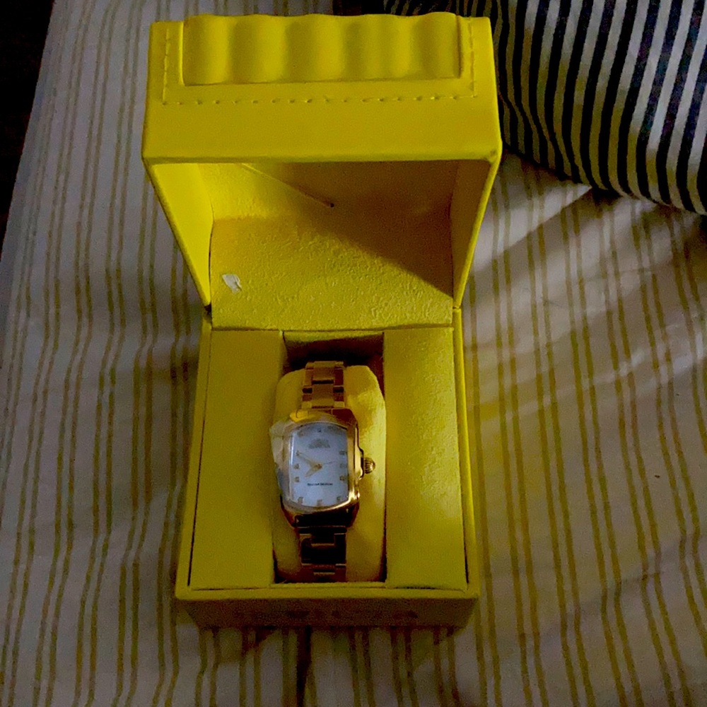 Women’s invicta watch in gold.